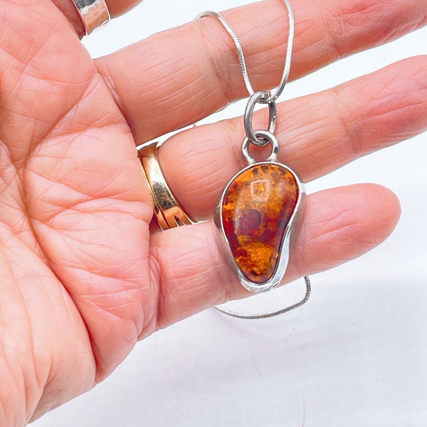 Sterling Silver Pendant Necklace With Genuine Amber Teardrop Design