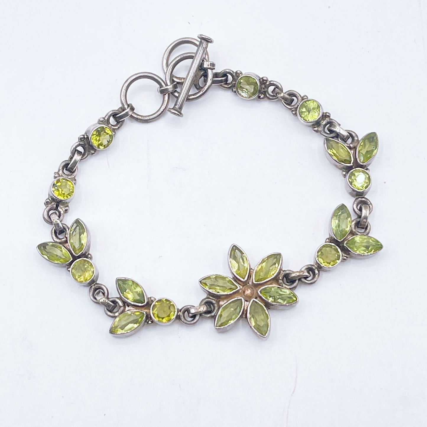 Sterling Silver Faceted Peridot Flower Bracelet With Toggle Clasp