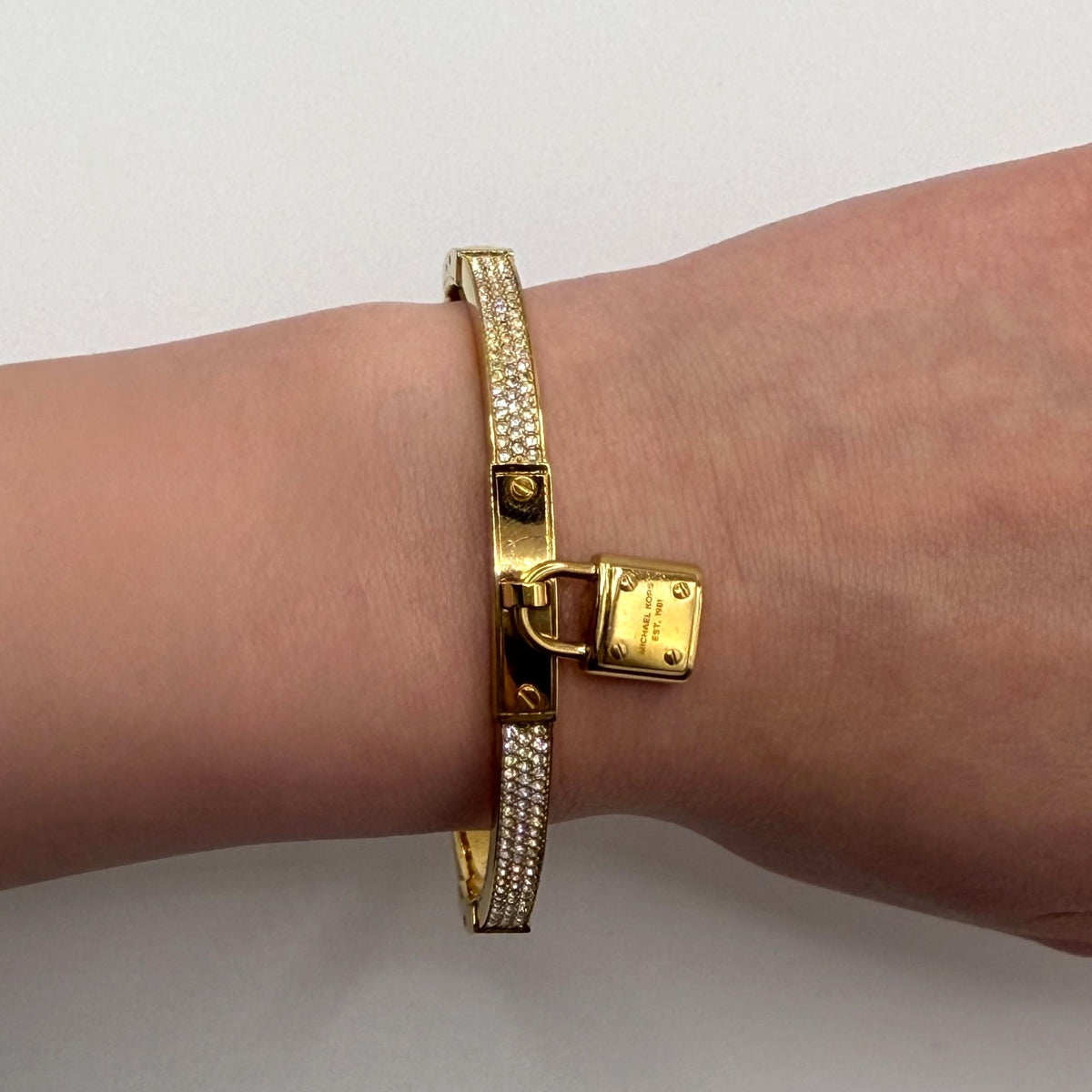 Michael Kors Goldtone Crystal Lock Hinged Bracelet With Pouch