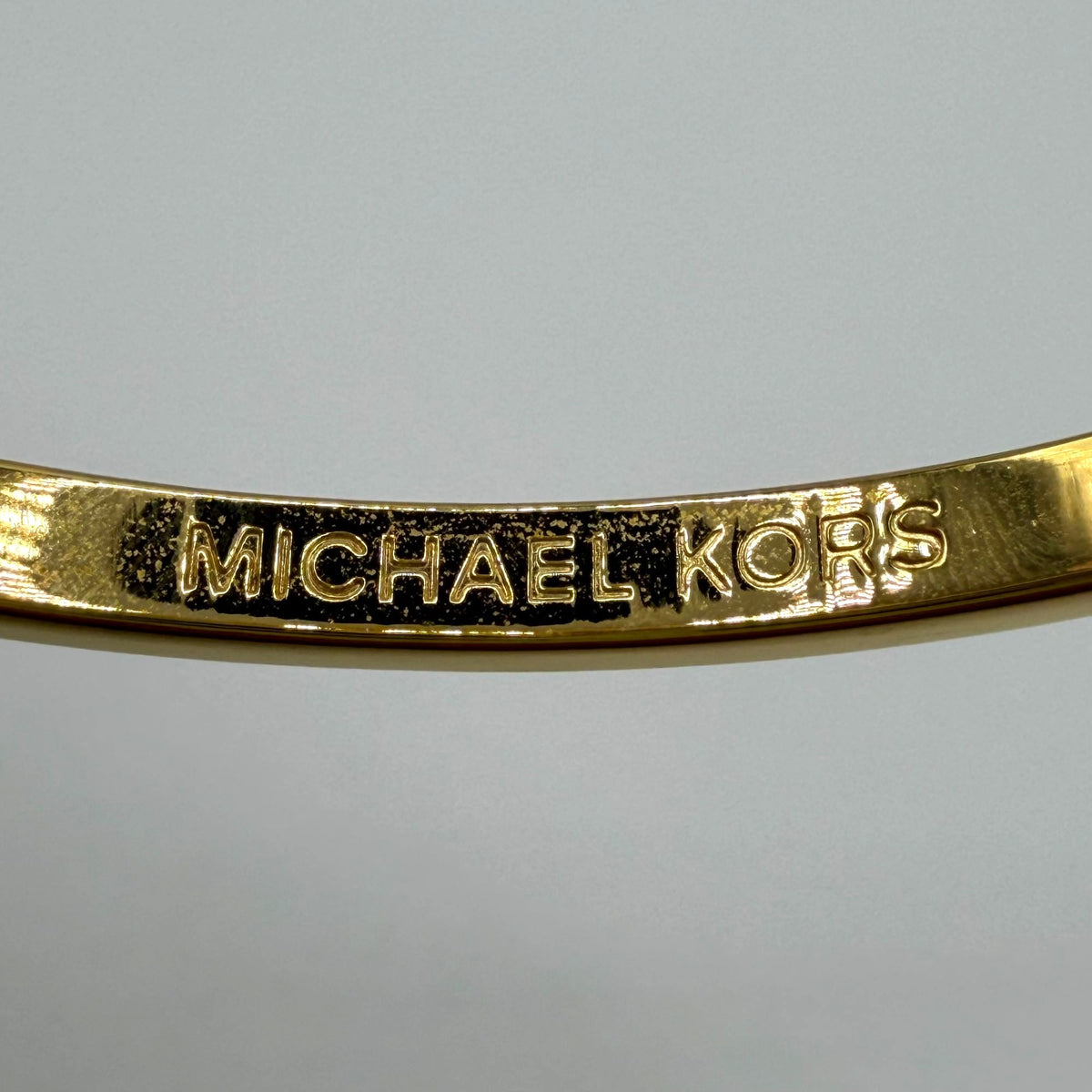Michael Kors Goldtone Crystal Lock Hinged Bracelet With Pouch