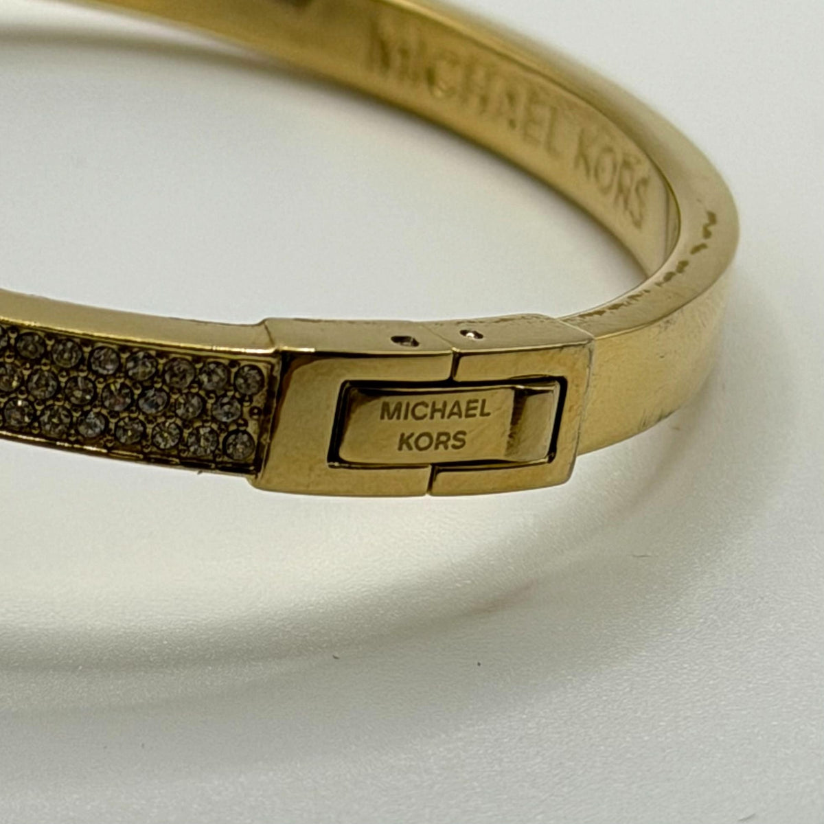 Michael Kors Goldtone Crystal Lock Hinged Bracelet With Pouch