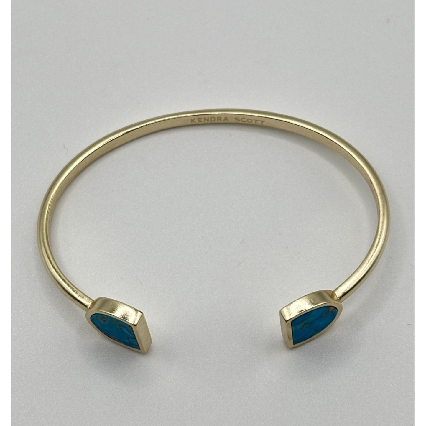 Kendra Scott Gold Tone Cuff Bracelet With Blue Stone Insets
