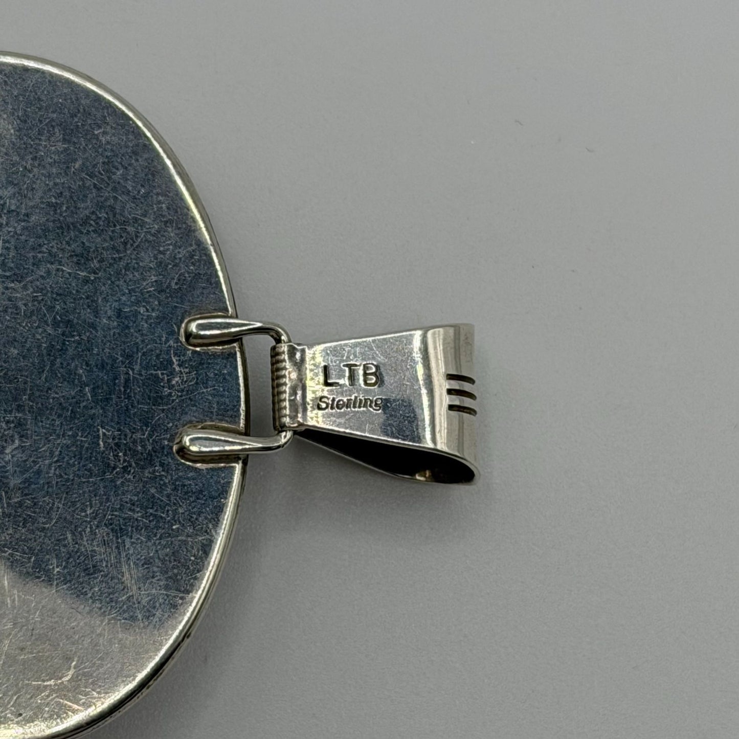 Loren Thomas Begay Sterling Silver Navajo Pendant With Oval Black Onyx Stone