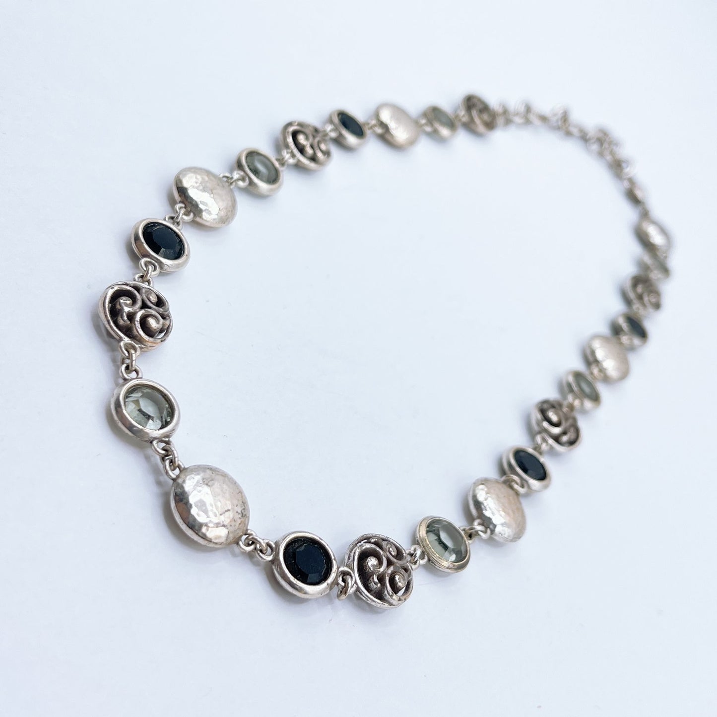 Brighton Necklace With Hammered Discs Swirl Accents & Black/Clear Gemstones
