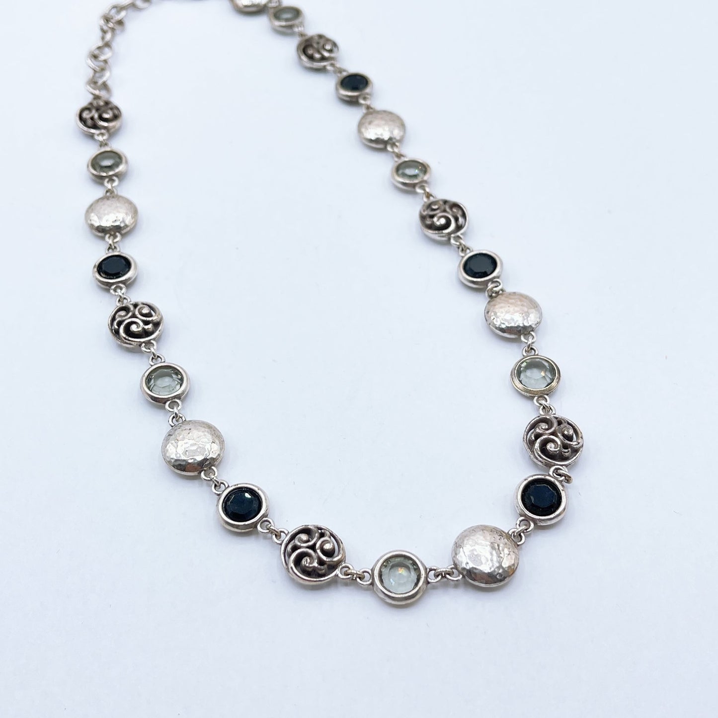 Brighton Necklace With Hammered Discs Swirl Accents & Black/Clear Gemstones