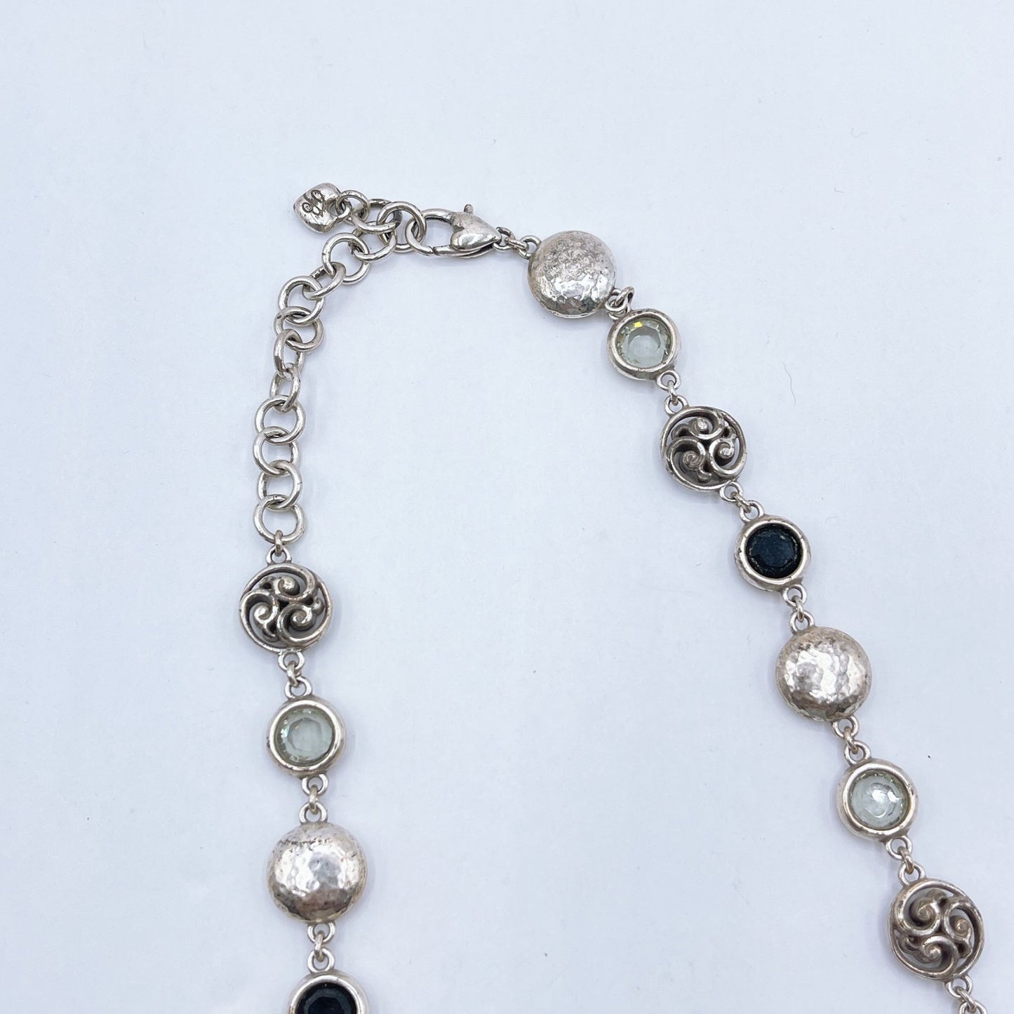 Brighton Necklace With Hammered Discs Swirl Accents & Black/Clear Gemstones