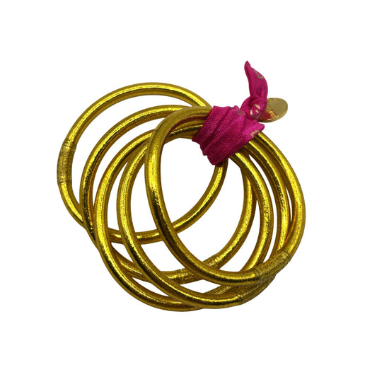 Set Of 5 Gold BudhaGirl All Weather Bangles With Pink Tassel & Charm